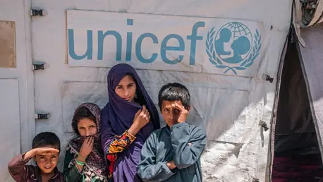 Children standing in front of a UNICEF tent