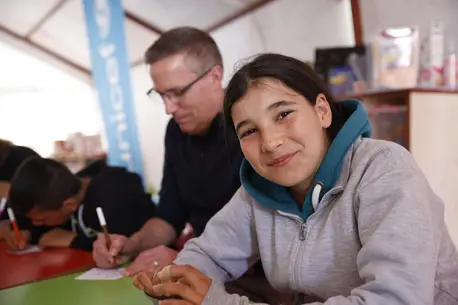 During a field visit to Kahramanmaras and Nurdagi, Türkiye, UNICEF USA President and CEO Michael J. Nyenhuis, rear, met with children who survived the 7.8 magnitude earthquake that struck Türkiye and Syria on Feb. 6, 2023.