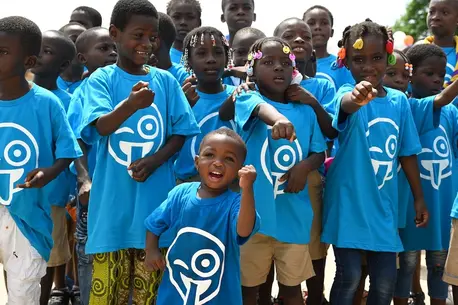 Kids in Abidjan, southern Côte d'Ivoire, participate in a community event on World Children's Day 2024.
