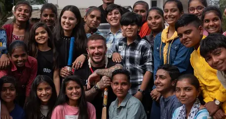 UNICEF Goodwill Ambassador David Beckham (centre) poses for a group photo with adolescents at the community centre in the Banaskantha district of Gujarat state.