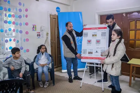 Children attend an awareness session about the risk of explosive ordnance at a UNICEF-supported child-friendly space in Deir-ez-Zor city, northeast Syria, on Feb. 6, 2024.