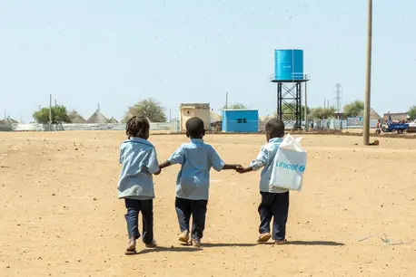 On March 2, 2025, children walk back home from a UNICEF-supported child-friendly space in Al Houri internally displaced people’s (IDP) camp in Gedaref State, Sudan.