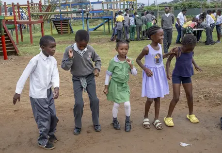 Young children play at a UNICEF-supported safe park in South Africa