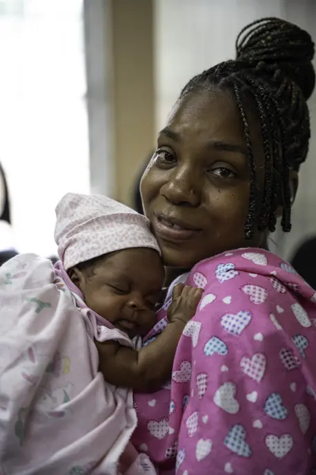 A mother and her child in Jamaica where public health workers are committed to child immunization.