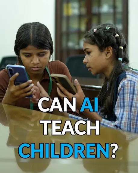 Two young girls look at their mobile phones