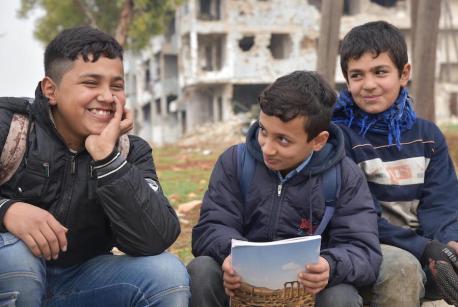 One out of three children in Syria are out of school. Hussein and Mohamed, left and center, go to school together in Aleppo, Syria, but their friend Mustafa, 12, does not. 
