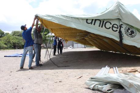 Volunteers Set Up a UNICEF Tent