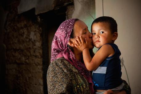  Zulhumar Amanbaev kisses her three-year-old son, Abdulmutalib, in Kyrgyzstan