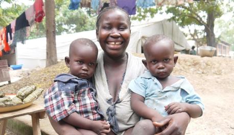 Twins and their mother just after they had their births registered at a major displacement sites in Bangui, Central African Republic.