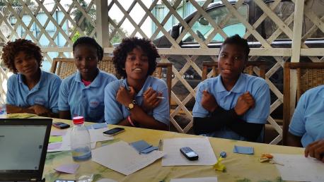 Girls in the West Point neighborhood of Monrovia, Liberia particpate in a workshop to help customize UNICEF's U-Report technology to reach the country's young people most effectively. UNICEF deployed U-Report in Liberia to help raise awareness of Ebola.
