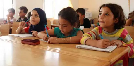 Fourth-grade classroom in a classroom in the Al Karnak camp, Tartous, Syrian Arab Republic.