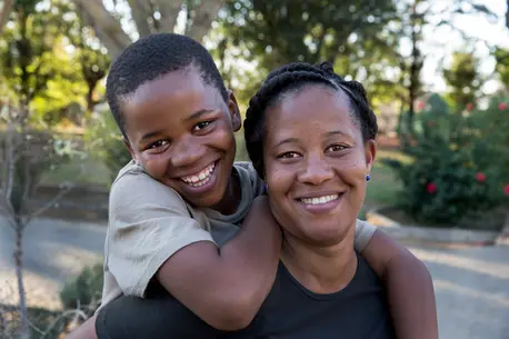 Two People Smiling and Hugging