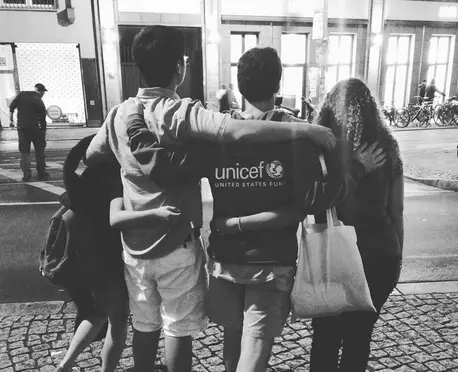 Group with Arms Around Eachother
