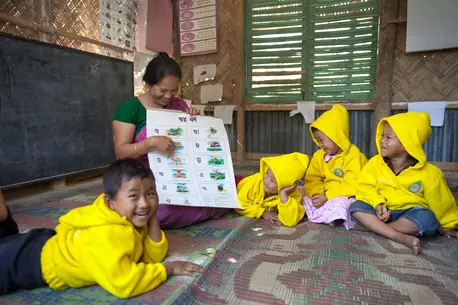 Woman Teaching Children