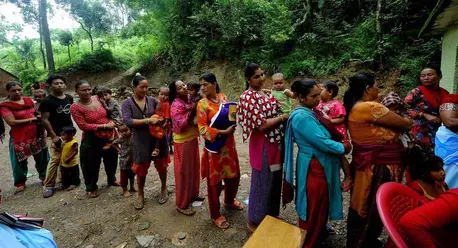 Women and Children Waiting in Line