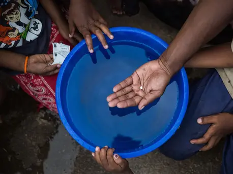 Verenaisi Lakosi from Lawaki village in Tailevu Province, holds a water purification tablet that she uses to make tap water safe and sanitary to drink.