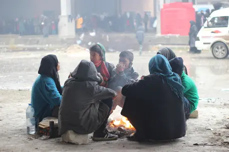 People Huddled Around Fire