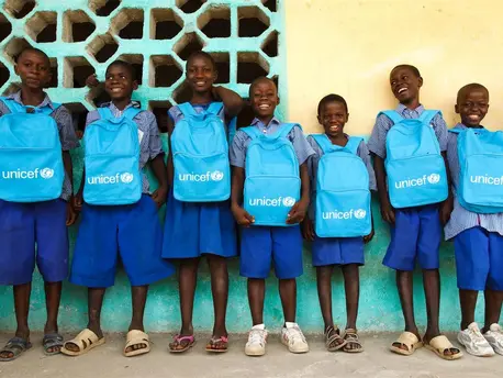 Students elected to the school government line up with their UNICEF backpacks line up outside the primary school in Bloleu Village in Dix-Huit Montagnes Region, Sierra Leone. Students elected to the school government line up with their UNICEF backpacks line up outside the primary school in Bloleu Village in Dix-Huit Montagnes Region, Sierra Leone.