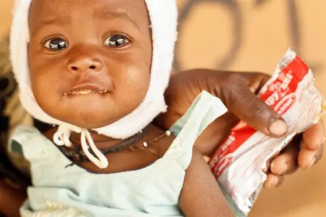 Child Next to Food Pouch