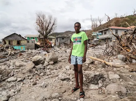 Child Surrounded by Rocks and Rubble