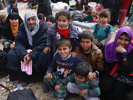 A newly displaced family from Mosul, Iraq arrive at Hamam al-Alil camp with very little luggage, unprepared to cope with the winter weather. A newly displaced family from Mosul, Iraq arrive at Hamam al-Alil camp with very little luggage, unprepared to cope with the winter weather.