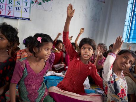 Eight-year-old Rohingya refugee Yasmin and other students at the "Prajapatti" (Butterfly) UNICEF learning center in the Kutupalong makeshift refugee settlement in Cox's Bazar, Bangladesh.