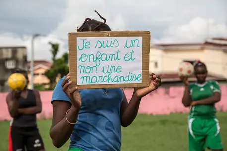 Child Holding Up a Sign