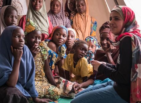 UNICEF Goodwill Ambassador and education activist Muzoon Almellehan meets with girls at a sewing class in a refugee camp in Chad.