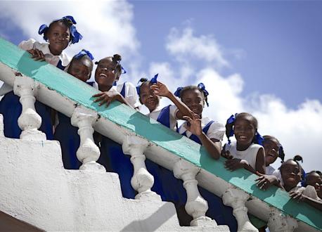 Haitian Girls Looking Over a Railing