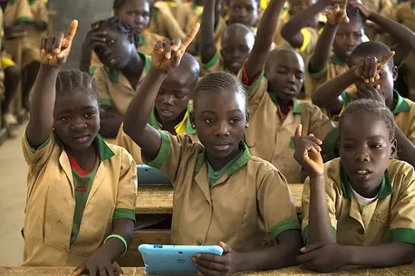 School Children Raising Hands
