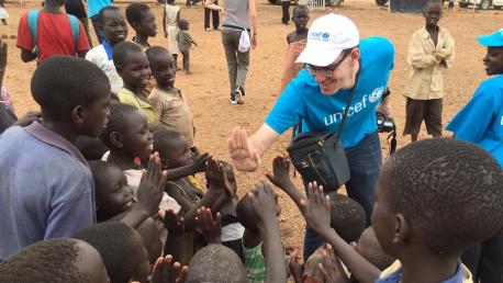 UNICEF Worker High Fiving Children
