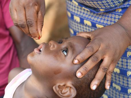 Gered, 18 months old, being vaccinated against polio during a UNICEF mobile vaccination campaign in the village of Dibobly, Côte d'Ivoire. 