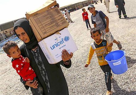 People Holding UNICEF Supplies