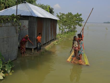 shot of girls in floodwaters in Bangladesh