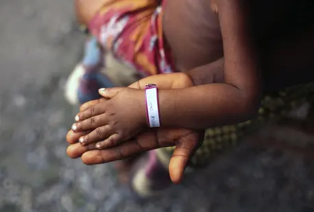 Child Hand on Top of Adult Hand