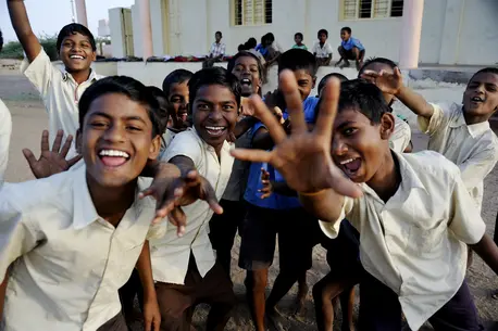 Children Waving at Camera