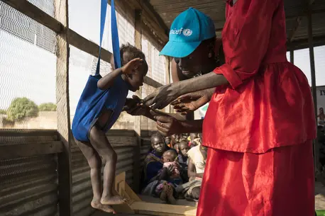 Two Women Playing with Baby