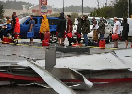 People with Gas Cans Waiting in Line