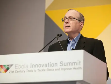 In 2015, Paul Allen committed $100 million to fighting the Ebola crisis in West Africa. At the Ebola Innovation Summit in April of 2015, Allen emphasized the importance of collaboration in the fight. Credit: Courtesy of Vulcan Inc.