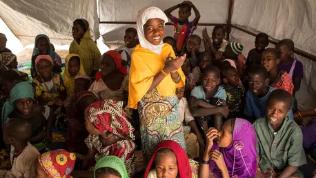 Girl Standing Surrounded by Happy Children