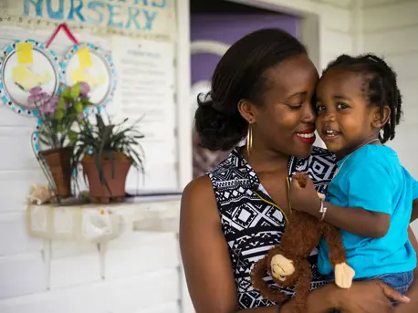 Denee, 28, picks up her 19-month-old son, Justice, from the daycare center where he stays while she teaches preschool on Nevis Island, St. Kitts and Nevis. Denee, 28, picks up her 19-month-old son, Justice, from the daycare center where he stays while she teaches preschool on Nevis Island, St. Kitts and Nevis.