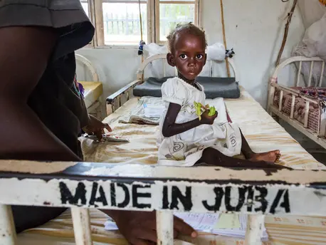Diagnosed with severe acute malnutrition, two-year-old Maria awaits treatment at a UNICEF-supported hospital in Juba, South Sudan in October 2017. Diagnosed with severe acute malnutrition, two-year-old Maria awaits treatment at a UNICEF-supported hospital in Juba, South Sudan in October 2017.