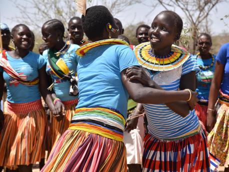 Adolescent girls and women from Ausikioyon village in Amudat District, Uganda celebrate after their village made a public declaration against Female Genital Mutilation (FGM).