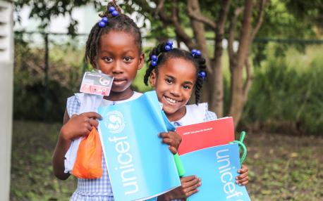 These girls, holding educational and recreational supplies from UNICEF, took shelter in St. John’s, capital of Antigua, where many families from Barbuda fled after Hurricane Irma hit on Sept. 6, 2017.