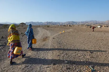 Children Walking with Buckets