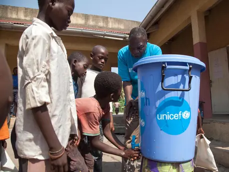 On 6 June 2018 in the Democratic Republic of the Congo, Leon Kalolo, a UNICEF Education Officer, instructs children how to properly wash their hands to prevent the spread of Ebola at Ikenge School in Mbandaka. unicef, ebola, democratic republic of the congo