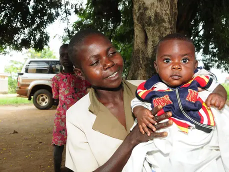 A mother plays with her baby as they wait for immunisation at Apeitolin Health Centre 11,in Napak district, Uganda. UNICEF, Uganda, infant mortality, immunization