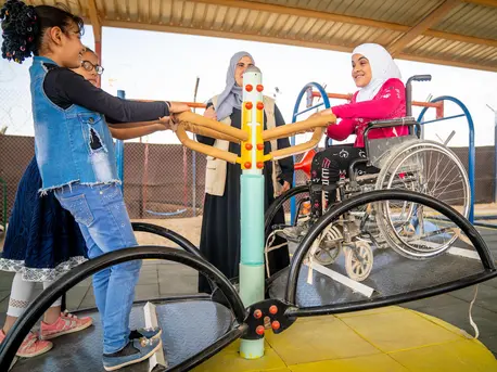 Syrian refugee children of all abilities play together in the new inclusive playground in Jordan's Za'atari Refugee Camp. Unicef, Za'atari Refugee Camp, inclusive playground