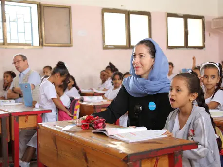 On 4 December 2018 at the Ibn Zaidoon School in Aden, Yemen, girls attend class with UNICEF Regional Director for Middle East and North Africa Geert Cappelaere (adult on left) and UNICEF Representative in Yemen Merixell Relano (adult on right). UNICEF, Yemen, humanitarian crisis, education, girls in school