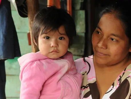 A mother holds her 1-year-old daughter in Cobán, Guatemala. unicef, unicef usa, immigration, immigrant children, guatemala